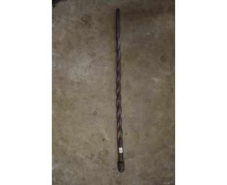 An African carved wood walking stick.