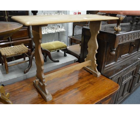 A small light oak refectory table.