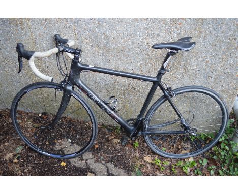 A Planet X carbon fibre racing bike (one fork broken).
