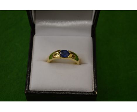 An 18ct gold ring set with a single sapphire.