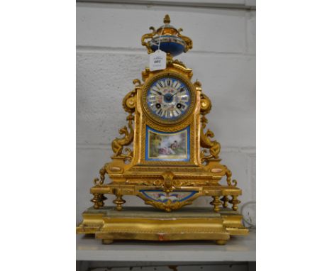  A French ormolu and porcelain mantel clock on stand.