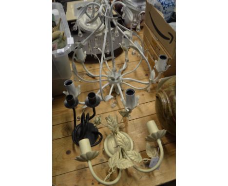 Decorative chandelier, wall light and a candelabra.