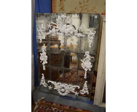 A highly unusual Oka Vincent Darre X rococo design mirror with applied decoration to the individual mirrored plates.