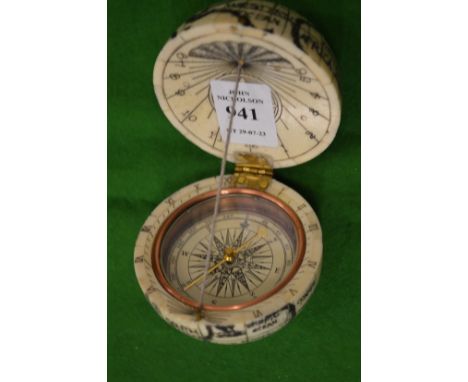 A bone pocket globe/compass.