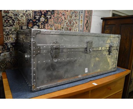 A stylish polished steel trunk.