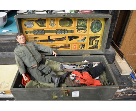 An Action man in original box with accessories.