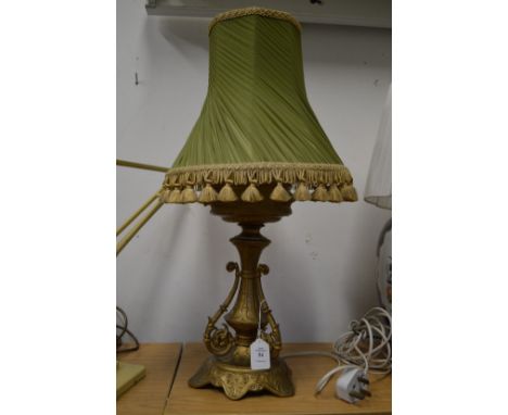 An ornate cast metal lamp.