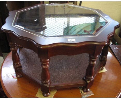 Modern mahogany finish octagonal coffee table with plate glass top and under shelf.(B.P. 24% incl. VAT)