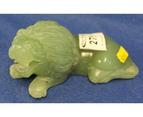Carved jade study of a recumbent lion. (B.P. 24% incl. VAT)