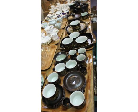 Four trays of Denby type dinnerware comprising: casserole dishes; plates; serving tray; cups and saucers; egg cups etc. (4)(B