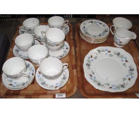 Two trays of Colclough bone china teaware on a white ground with autumn leaf decoration comprising tea cups and saucers, milk