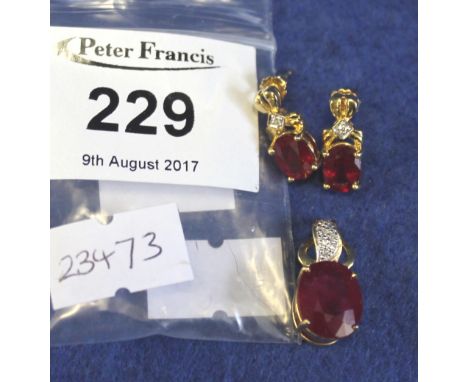 18ct gold ruby (treated) and diamond pendant and pair of matching earrings, 6.7g approx. (3)(B.P. 24% incl. VAT)   CONDITION 