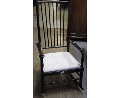 20th Century ebonised stick backed rocking chair with drop-in upholstered seat.(B.P. 24% incl. VAT)