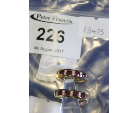 18ct gold ruby and diamond oval hoop earrings, 6.2g approx. (2)(B.P. 24% incl. VAT)   CONDITION REPORT:  No obvious damage