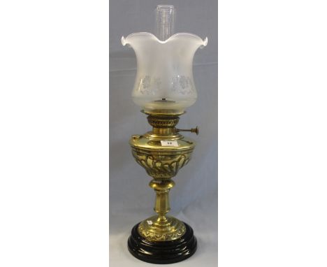 Brass oil lamp with ceramic base, frosted glass shade and clear chimney.(B.P. 24% incl. VAT)