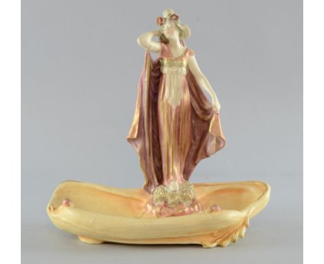 An Austrian Jugendstil figural card tray by Amphora, Reissner, Stellmacher & Kessel, impressed and painted marks, 25cm, width