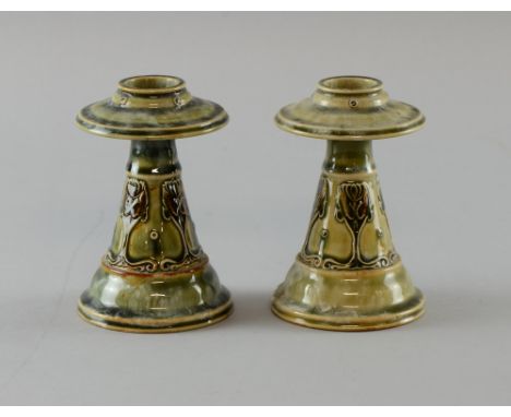 Pair of Doulton stoneware candlesticks decorated with Art Nouveau style floral decoration. 10.5 cm 5in. (13cm)     Chip to on