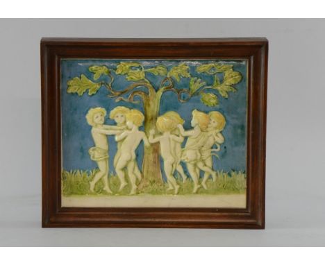 Della Robia pottery 1894-1906 plaque moulded with children playing around a tree, , painted and incised marks painted DR mark