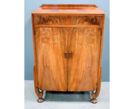 Art Deco walnut gentlemans dresser, single drawer to cupboard doors on scrolled legs to bun feet 108cm h 72cm w 45cm d     