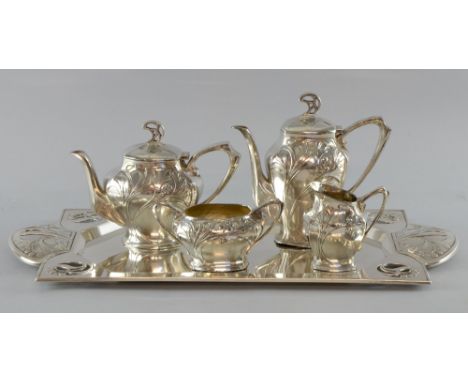 WMF Art Nouveau tea set decorated with berries and foliate decoration c. 1910 comprising tea pot, hot water jug, milk jug on 