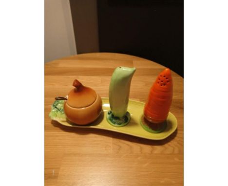 A CARLTONWARE NOVELTY CRUET MODELLED AS CARROT, ONIONS AND PEA POD ON A CORN ON THE COB