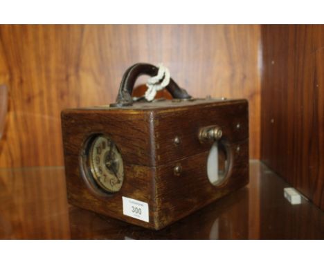 A VINTAGE OAK CASED PIGEON RACING CLOCK