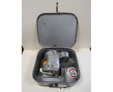 A VINTAGE ALMEX TICKET MACHINE IN METAL CASE