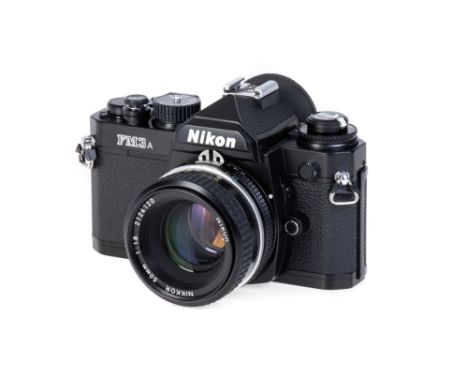 A Nikon FM3a SLR Camera Outfit, 2001, black, serial no. 252485, with Nikon Ai Nikkor f/1.8 50mm lens, black, serial no. 21241