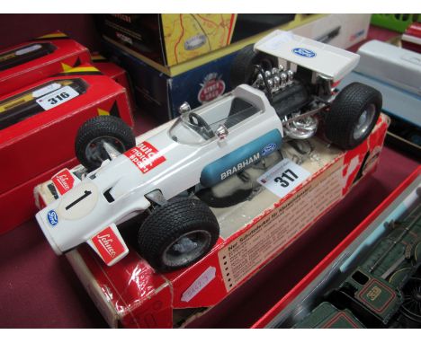 A Schuco 1:16th Scale Tin Plate Model #1075 Brabham Ford B733 Formula One Racing Car, some signs of corrosion noted, no key, 