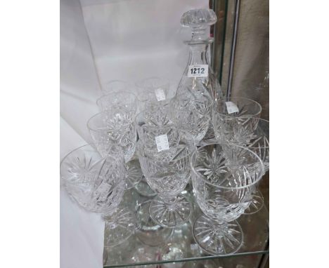 A cut glass decanter and stopper - sold with twelve matching small wine goblets