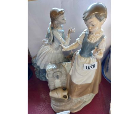 A large Lladro figurine depicting a woman picking flowers - sold with a similar Nao figurine - various condition