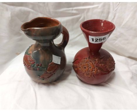 A Sunflower Pottery Clevedon Eltonware jug of ewer form with enamelled floral decoration on a red and blue streaky ground - s