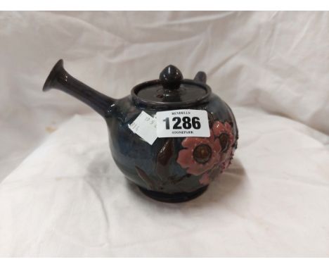 A Sunflower Pottery Clevedon Eltonware sake pot with enamelled floral decoration on a purple streaky ground - lid restored