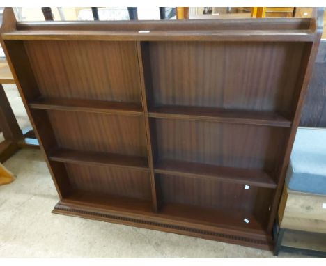 A 1.29m 20th Century mahogany wall mounted three shelf open plate rack