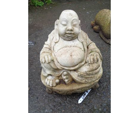 A 28cm cast concrete statue of a seated Buddha
