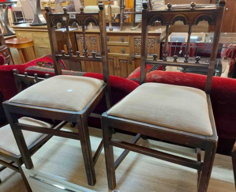 Three matching vintage Ercol dark stained elm 'Gothic' pattern spindle back dining chairs with upholstered drop-in seats