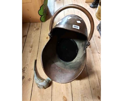 A 19th Century copper coal scuttle of helmet form - sold with a modern cast metal bird form ornament