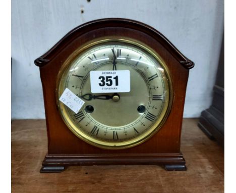 A vintage Smiths polished walnut cased mantel clock with eight day gong striking movement