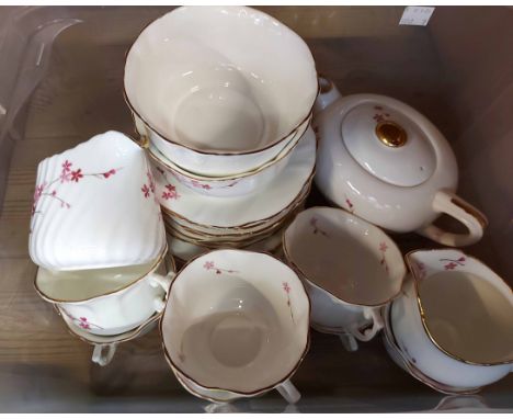 A crate containing an Ashley bone china part tea set including teapot, milk and sugar, cups and saucers, etc.