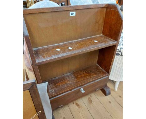 A 58cm vintage stained mixed wood two shelf open bookcase with fall-front drawer under