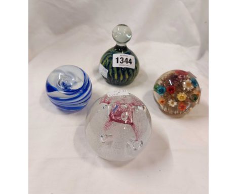 A Mdina glass paperweight with internal enamel decoration and a Caithness Congratulations paperweight with controlled bubble 
