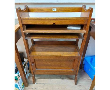 A 58cm Edwardian polished oak freestanding bookcase with trough to top, pull-out surface, open shelf and cupboard under