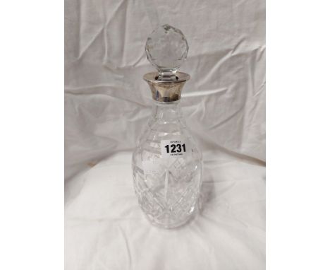 A Stuart Crystal decanter and stopper with silver collar