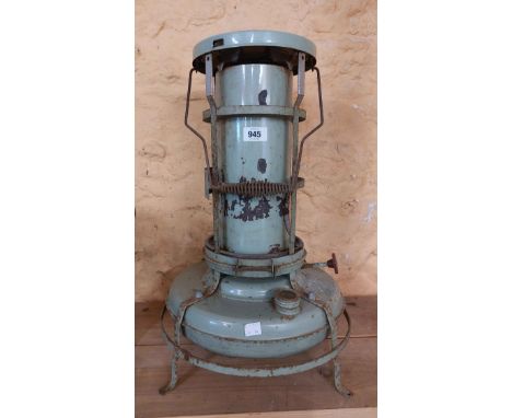A vintage Aladdin greenhouse heater with enamel reservoir and chimney - sold with an old Tilley lamp and spare wick