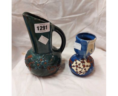 A Sunflower Pottery Clevedon Eltonware jug with enamelled floral decoration on a green and blue streaky ground - sold with a 