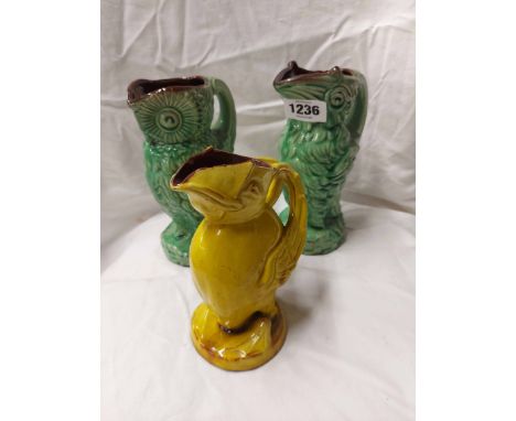 A C.H. Brannam Barnstaple art pottery jug in the form of a bird with yellow glaze over and Made for Liberty stamp mark to bas