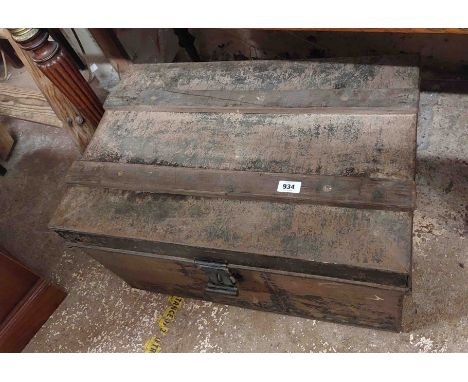 An old tin trunk containing a quantity of curtains