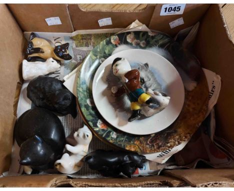 A small box containing two collectors' plates, cat figurines and a Poole Pottery cat plate
