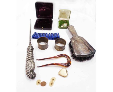 An ornate silver handled button hook, a marked 'sterling' hairbrush with internal comb, various items of costume jewellery an