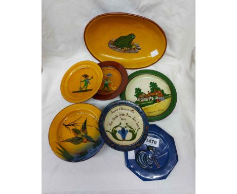 A quantity of Torquay pottery dishes and stands including Aller Vale, C.H. Brannam, etc.